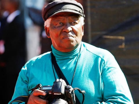 File photo: Veteran photojournalist Peter Magubane looks on during the funeral of Albertina Sisulu, a leading light of the former anti-apartheid movement and widow of an early mentor of Nelson Mandela, in Johannesburg, South Africa June 11, 2011. 