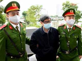 Former Vietnam health minister tried over COVID test bribes