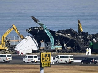 Crews begin clearing plane wreckage from Japan runway collision