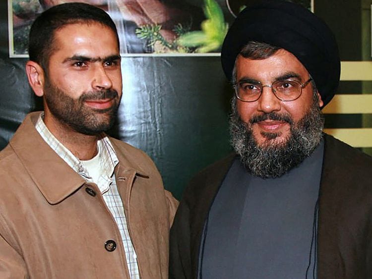 Wissam Al Tawil with Hassan Nasrallah in a file photo.