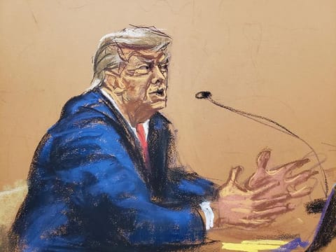 Former US president Donald Trump gives brief closing arguments while seated at the defense table in the Trump Organisation civil fraud trial at New York State Supreme Court in the Manhattan borough of New York City, on January 11, 2024 in this courtroom sketch.  