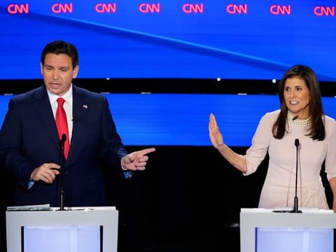 Former UN Ambassador Nikki Haley, right, and Florida Gov. Ron DeSantis, left, both speaking at the CNN Republican presidential debate at Drake University in Des Moines, Iowa, Wednesday, Jan. 10, 2024. (AP Photo/Andrew Harnik)