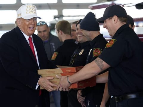 Trump delivers pizza to fire fighters at Waukee Fire Department in Waukee, Iowa, on January 14, 2024.  