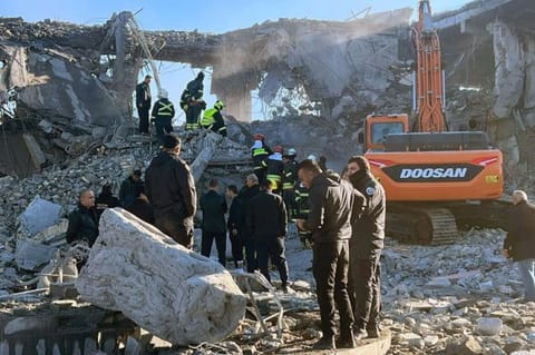 Firemen and security staff inspect the rubble of a building at a site hit by a missile attack launched by Iran's Islamic Revolutionary Guard Corps (IRGC), in Arbil, the capital of Iraq's northern autonomous Kurdish region on January 16, 2024. 
