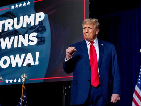 Republican presidential candidate former President Donald Trump takes the stage at a caucus night party in Des Moines, Iowa, ON JanUARY 15, 2024.  