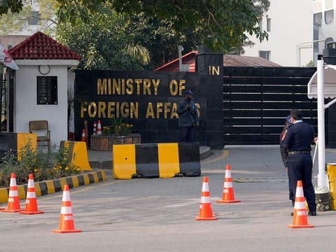 Police officers stand guard at the main entry gate of Pakistan's Ministry of Foreign Affairs, in Islamabad, Pakistan, Thursday, Jan. 18, 2024. 
