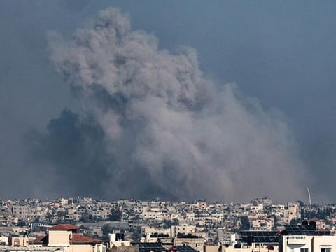 A picture taken from Rafah shows smoke billowing over Khan Yunis in the southern Gaza Strip during Israeli bombardment on January 20, 2024. 