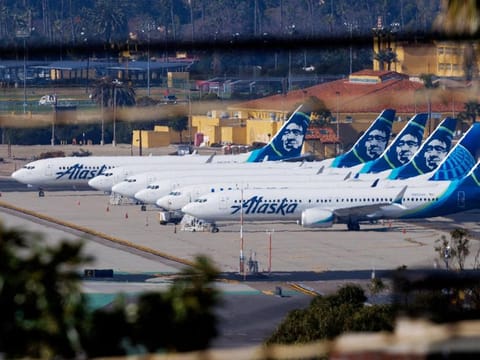 File photo: Alaska Airlines commercial airplanes are shown parked off to the side of the airport in San Diego, California.  