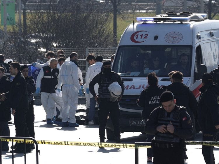 Forensic experts examine the area after a shooting outside the Caglayan courthouse in Istanbul on February 6, 2024.  
