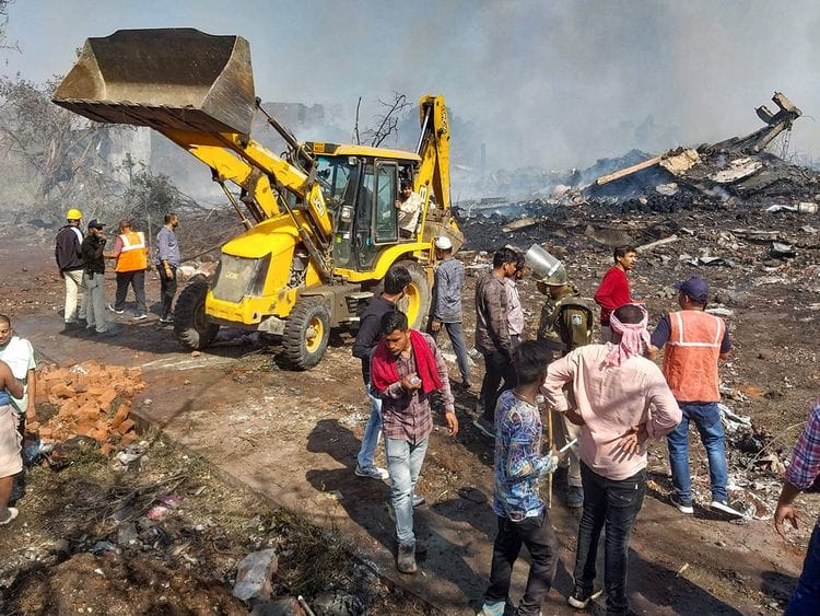 Rescue personnel and local residents gather near a firecracker plant following an explosion at Harda district in India's Madhya Pradesh state on February 6, 2024.  