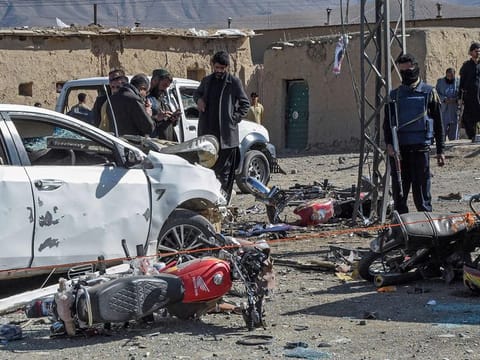  Security personnel inspect the site of a bomb blast outside the office of an independent candidate in Pishin district, around 50 kilometres (30 miles) from Quetta on February 7, 2024.