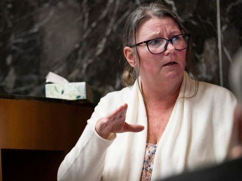 Jennifer Crumbley, the mother of a Michigan boy who shot dead four high-school classmates in 2021, testifies on the stand in an Oakland County courtroom in Pontiac, Michigan, U.S., February 1, 2024. 