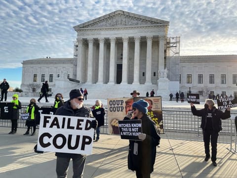 Demonstrators gather outside the US Supreme Court ahead of arguments in former US President Donald Trump's appeal of a lower court's ruling disqualifying him from the Colorado presidential primary ballot, in Washington, on February 8, 2024.  