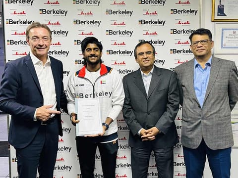 Badminton player Bharath Latheesh with BSG officials - Karl Heinz Otto Mair (CEO), Jawad Ahmad Bhatti (CFO), and Jiji Francis (COO). 