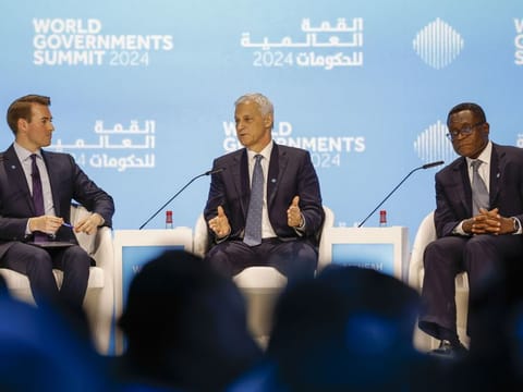 Bill Winters (centre), CEO of Standard Chatered Bank, gestures during a session "From Gold to Code: The Next Frontiers of Banking" at World Governments Summit at Madinat Jumeirah in Dubai. At right is Bernard Mensah, President of International Bank of America, with moderator Daniel Murphy (left), CNBC National Reporter. Photo taken on February 12, 2024. 