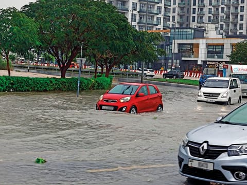 Several motorists left their cars parked on flooded streets during Tuesday's rains. 
