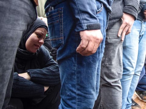 Mourners attend in the southern Lebanese village of Al Qantara on February 15, 2024 the funeral of a woman and two children killed yesterday during an Israeli air strike in the village of Al Sawwaneh.  