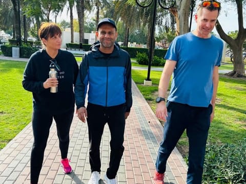Dr Asad Sadiq (centre) encourages people to walk with others so they can talk their problems away
