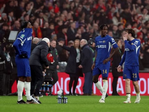 Chelsea's Noni Madueke, Trevoh Chalobah and Ben Chilwell react after losing the Carabao Cup final to Liverpool at Wembley Stadium, London, Britain on February 25.