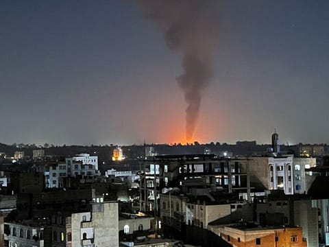 Smoke rises in the sky following US-led airstrikes in Sana'a, Yemen, on February 25, 2024. 