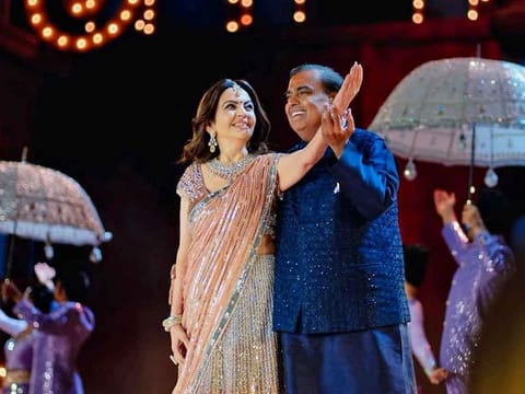 Mukesh Ambani and wife Nita Ambani dance during the pre-wedding celebrations of their son.