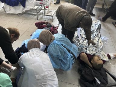 Palestinians wounded in an Israeli strike while waiting for humanitarian aid on the beach in Gaza City are treated in Shifa Hospital in Gaza City, Thursday, Feb. 29, 2024.  