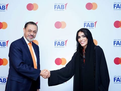 Khalid Elgibali, Division President, Middle East and North Africa, Mastercard (L) and Futoon Al Mazrouei, Group Head of Consumer Banking, UAE, FAB [R]