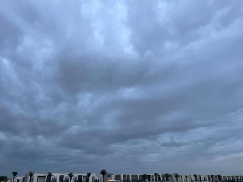 Overcast skies and heavy rain in Dubai.