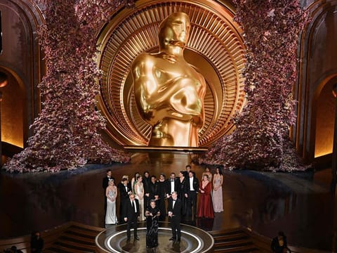 Producers of "Oppenheimer" British film producer Emma Thomas (C), US film producer Charles Roven (L) and British filmmaker Christopher Nolan accept the award for Best Picture onstage during the 96th Annual Academy Awards at the Dolby Theatre in Hollywood, California on March 10, 2024. 