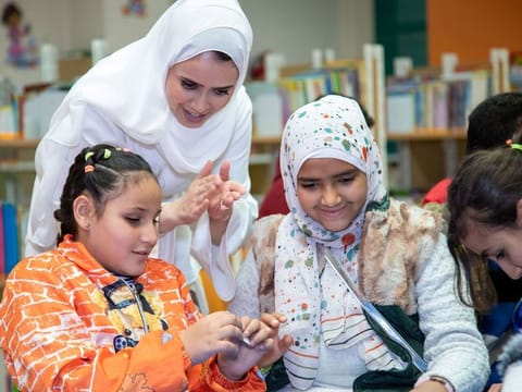 Families in refugee camps abroad make the most of Arabic books donated by Kalimat Foundation