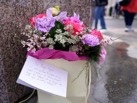 Flowers and a letter to the Princess of Wales were left outside Windsor Castle in Windsor, England, Saturday, March 23, 2024.  