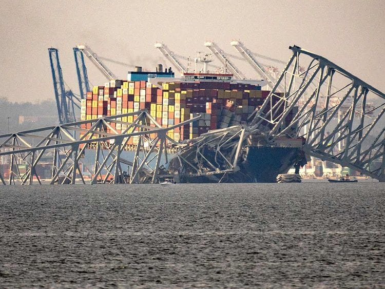 Part of the steel frame of the Francis Scott Key Bridge sits on top of the container ship Dali after the bridge collapsed in Baltimore, Maryland, on March 26, 2024. 