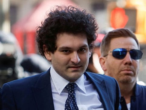 Former FTX Chief Executive Sam Bankman-Fried, who faces fraud charges over the collapse of the bankrupt cryptocurrency exchange, walks outside the Manhattan federal court in New York City, U.S. March 30, 2023.