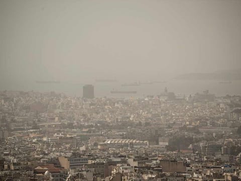 The city of Athens shrouded in haze as persistent southerly winds have carried waves of dust from the African continent across the eastern Mediterranean. 
