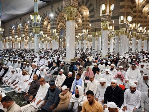 The faithful pray at Prophet's Mosque in Medina. Visitors to Al Rawdah Al Sharif must comply with specific entry instructions, which are provided upon obtaining a permit through the Nusuk application.