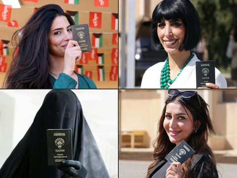  Kuwaiti women display their passports as they arrive to vote in parliamentary elections at a polling station in Kuwait City on April 4, 2024.