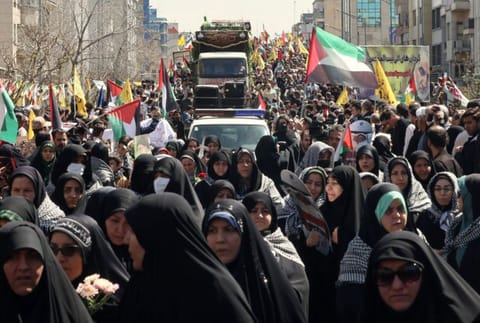 Iranians attend the funeral of seven Revolutionary Guard Corps members killed in a strike on the country's consular annex in Damascus, which Tehran blamed on Israel, on April 5, 2024, during their funeral procession in Tehran.  