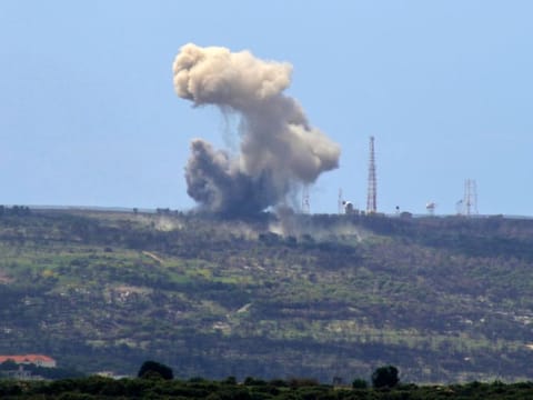 A picture taken from the southern Lebanese village of Alma Al Shaab shows smoke rising from an Israeli outpost after a rocket attack by Hezbollah militants on April 6, 2024.  