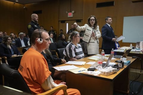 (From left) James Crumbley, his attorney Mariell Lehman, Jennifer Crumbley, and her attorney Shannon Smith, sit in court for sentencing on four counts of involuntary manslaughter for the deaths of four Oxford High School students who were shot and killed by the Crumbley parents' son, on April 9, 2024 at Oakland County Circuit Court in Pontiac, Michigan.  