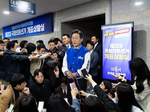 Lee Jae-myung, leader of the Democratic Party, centre, speaks to the media at the party's office in the National Assembly in Seoul, South Korea, on Wednesday, April 10, 2024.  
