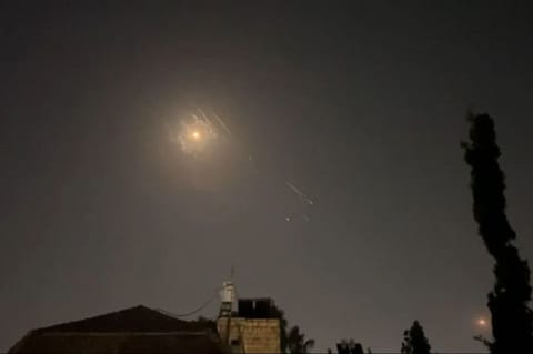 This video grab from AFPTV taken on April 14, 2024 shows explosions lighting up Jerusalem sky during Iranian attack on Israel.  