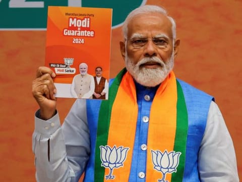 Modi releases the BJP election manifesto 'Sankalp Patra' at the party headquarters extension in New Delhi on Sunday. He is flanked by federal Home Minister Amit Shah, Defence Minister Rajnath Singh, Finance Minister Nirmala Sitharaman and party President JP Nadda.