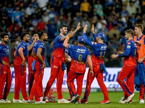 Royal Challengers Bengaluru’s players celebrate after the dismissal of Mumbai Indians’ Rohit Sharma during the Indian Premier League Twenty20 cricket match at the Wankhede Stadium in Mumbai on April 11, 2024. RCB’s campaign has floundered, losing six of the first seven games. 