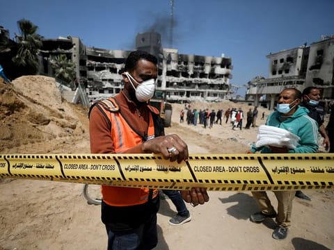 File photo: A man tapes off the area as rescuers and medics search for dead bodies inside the damaged Al Shifa Hospital after Israeli forces withdrew from the hospital and the area around it following a two-week operation, in Gaza City April 8, 2024. 