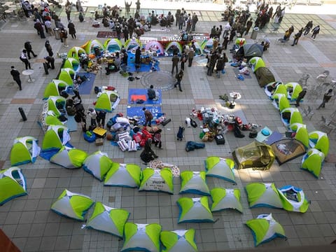 New York University students set up a "Liberated Zone" tent encampment in Gould Plaza at NYU Stern School of Business on April 22, 2024 in New York City. 