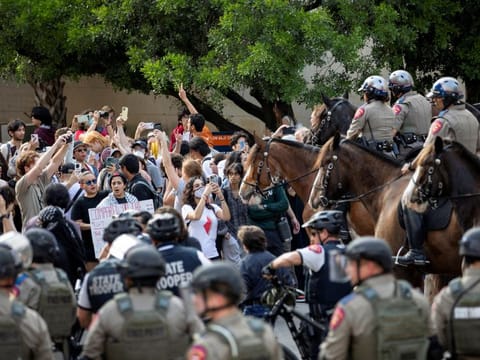 Law enforcements face off against pro-Palestinian protesters at the University of Texas in Austin on April 24, 2024.  