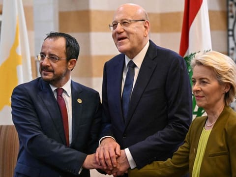 Lebanon's Prime Minister Najib Mikati (centre) poses for a picture with European Commission President Ursula von der Leyen and Cypriot President Nikos Christodoulides during their meeting at the Grand Serail government headquarters in Beirut on May 2, 2024.  
