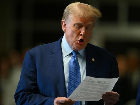 Former US President Donald Trump speaks to the press before his trial for allegedly covering up hush money payments linked to extramarital affairs, at Manhattan Criminal Court in New York City, on May 9, 2024.  