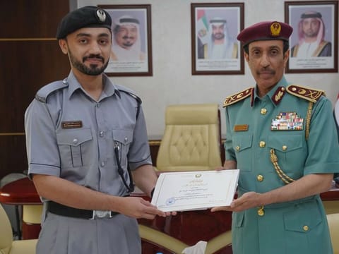 Al Bloushi (L) being honoured by the Commander-in-Chief of Ajman Police, Major General Sheikh Sultan bin Abdullah Al Nuaimi