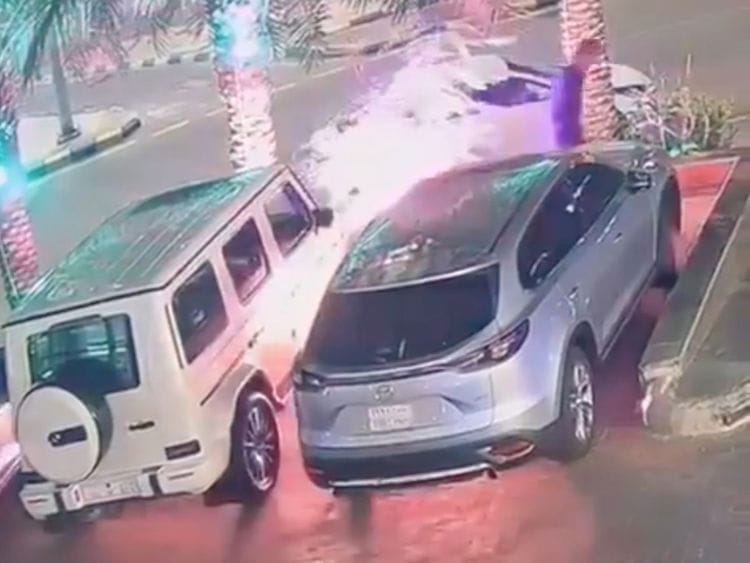 The arsonist is seen in the video filmed by a surveillance camera carrying two jericans apparently containing petrol, approaching a Mercedes and torching it before fleeing the scene.